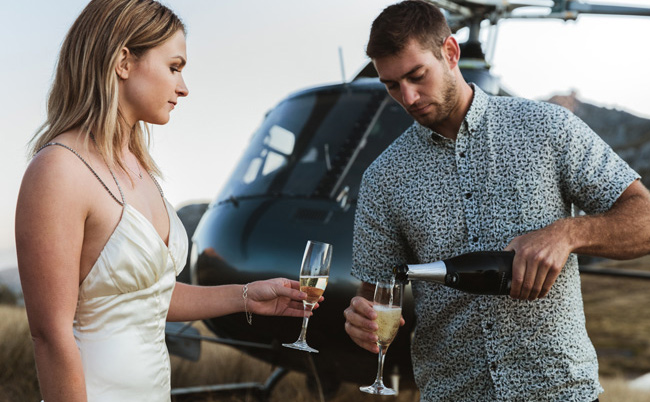 Champagne couple helicopter