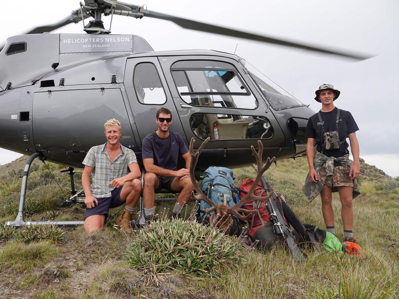 hunters with stag helicopter